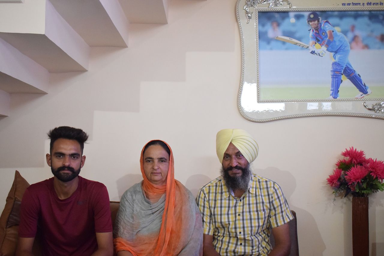 Harmanpreet Kaur's family at their home in Moga. From left: brother Gary, mother Satwinder, and father Harmandar Singh Bhullar, July 22, 2018