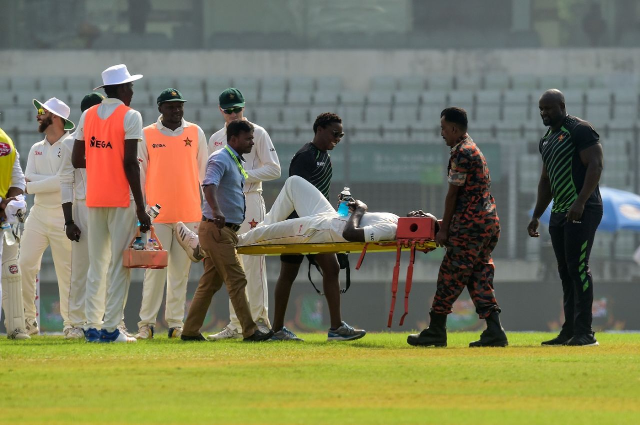 Tendai Chatara is stretchered off after picking up a leg injury, Bangladesh v Zimbabwe, 2nd Test, Mirpur, 2nd day, November 12, 2018