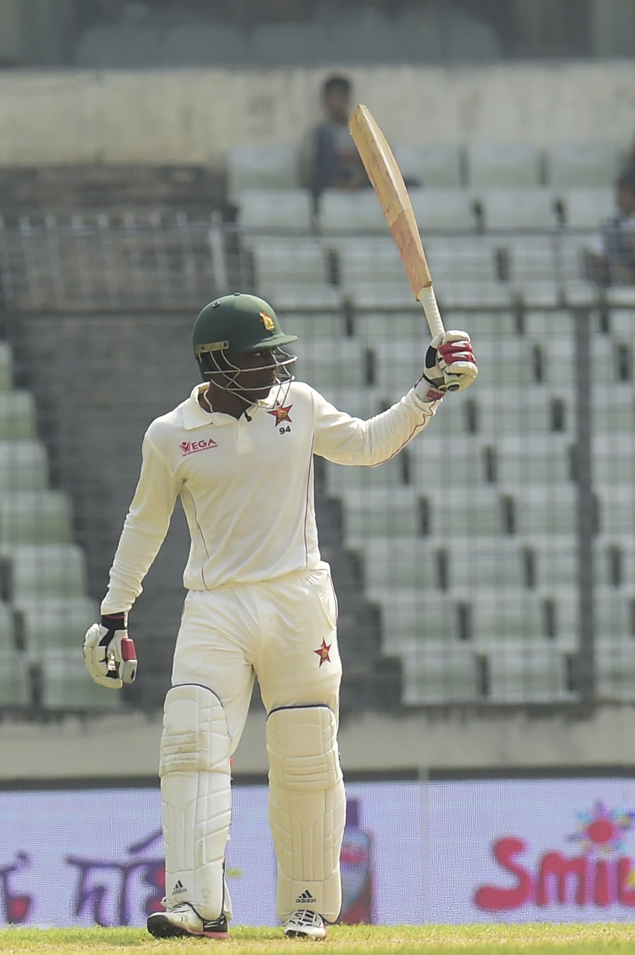 Brian Chari raises his bat after reaching a half-century, Bangladesh v Zimbabwe, 2nd Test, Mirpur, 3rd day, November 13, 2018
