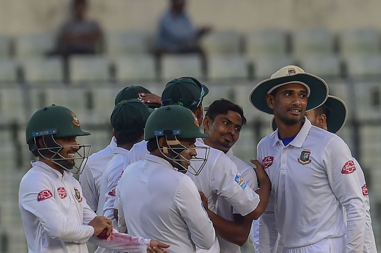 Taijul Islam mobbed by his teammates after completing a five-for, Bangladesh v Zimbabwe, 2nd Test, Dhaka, 3rd day, November 13, 2018
