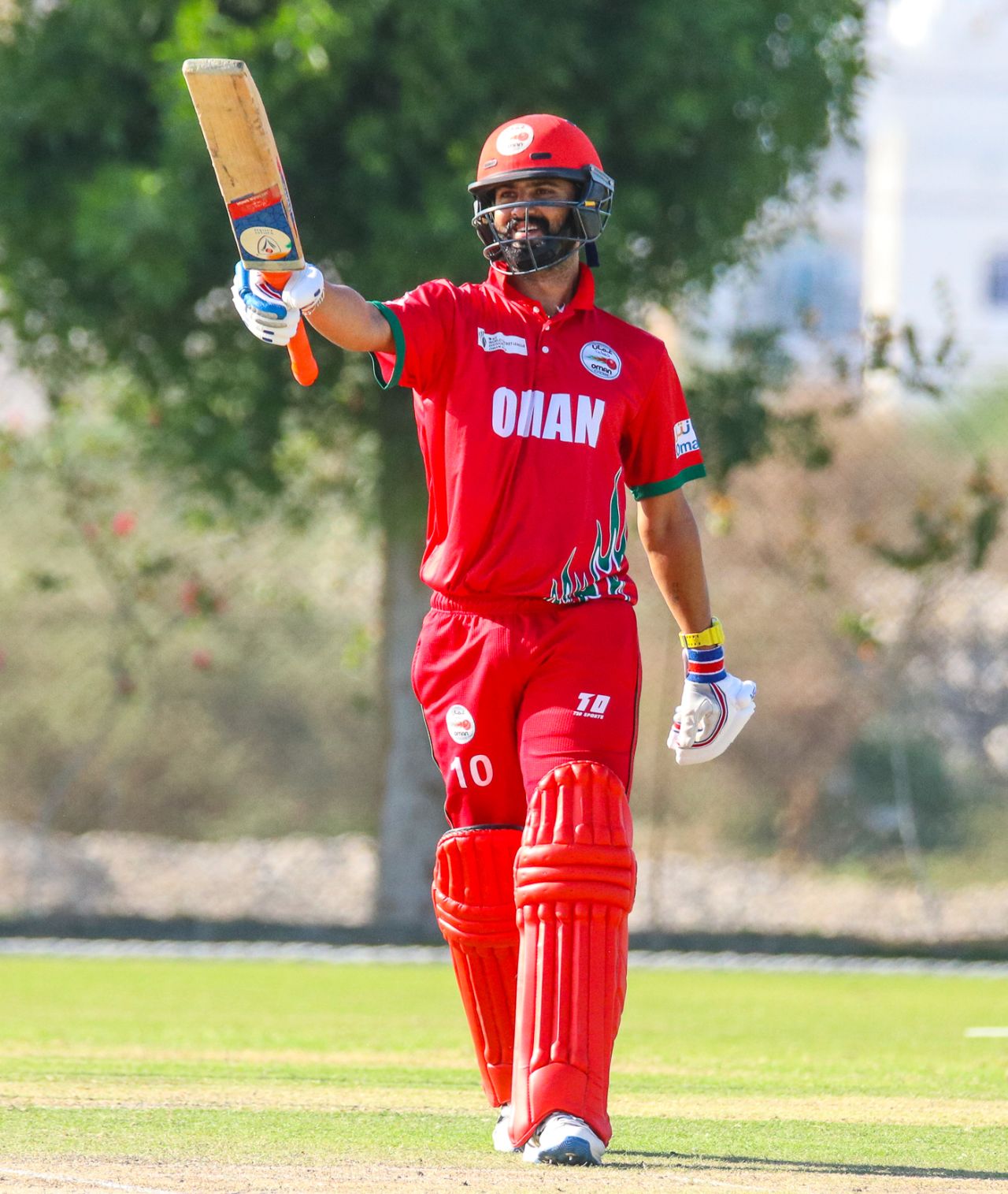 Jatinder Singh points his bat to the Oman dugout after reaching a half-century, Oman v Denmark, ICC World Cricket League Division Three, Al Amerat, November 13, 2018