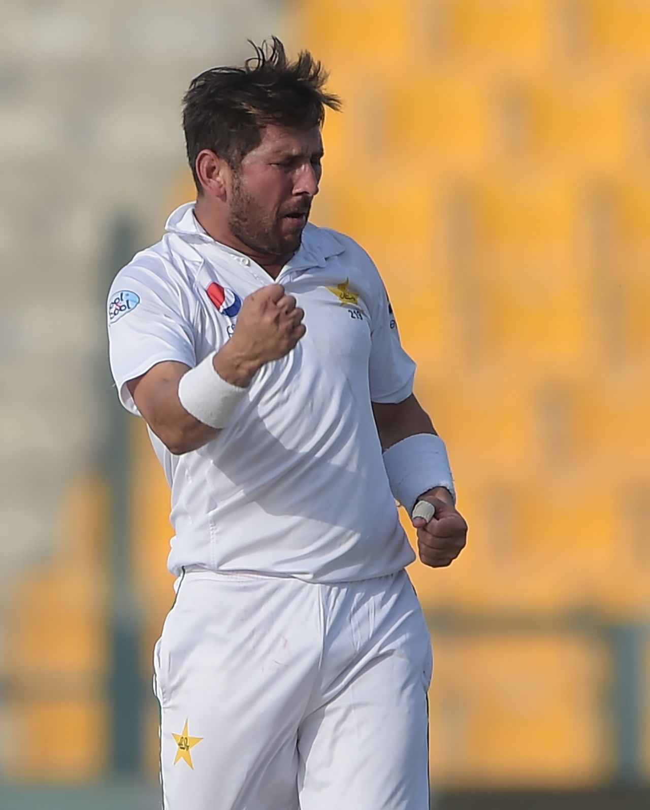 Yasir Shah punches in the air after picking a wicket, Pakistan v New Zealand, 1st Test, Abu Dhabi, 1st day