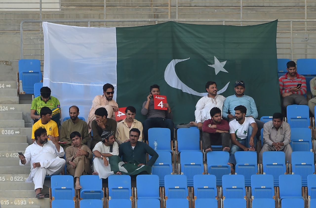Pakistani supporters watch the action unfold at the Sheikh Zayed Stadium, Pakistan v New Zealand, 1st Test, 1st day, Abu Dhabi, 