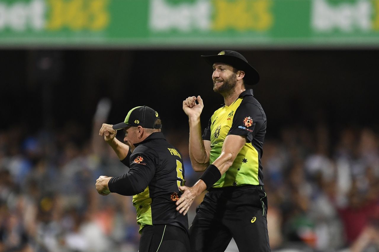 Aaron Finch and Andrew Tye celebrate a wicket, Australia v India, 1st T20I, Brisbane, November 21, 2018