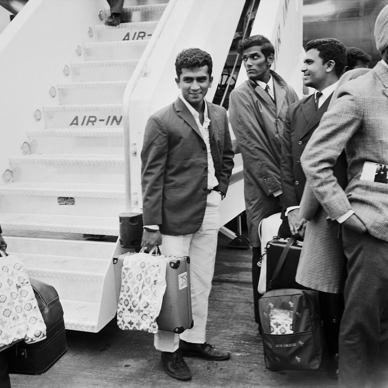 Indian Test cricketers get off the plane at the start of the tour of England. Sunil Gavaskar is centre. London, June 18, 1971