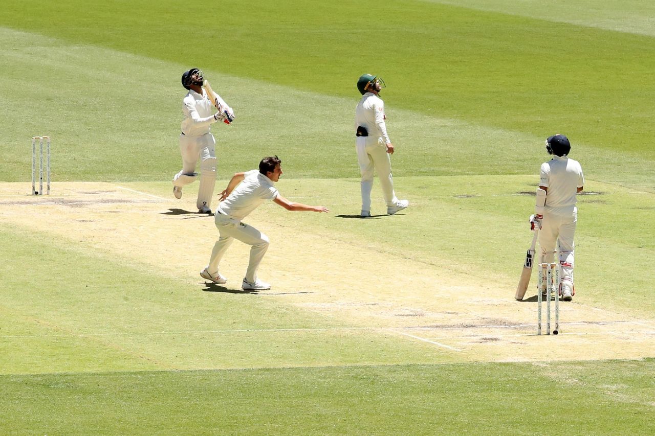 Pat Cummins scurries to get into position to take a high return catch, Australia v India, 2nd Test, Perth, 5th day, December 18, 2018
