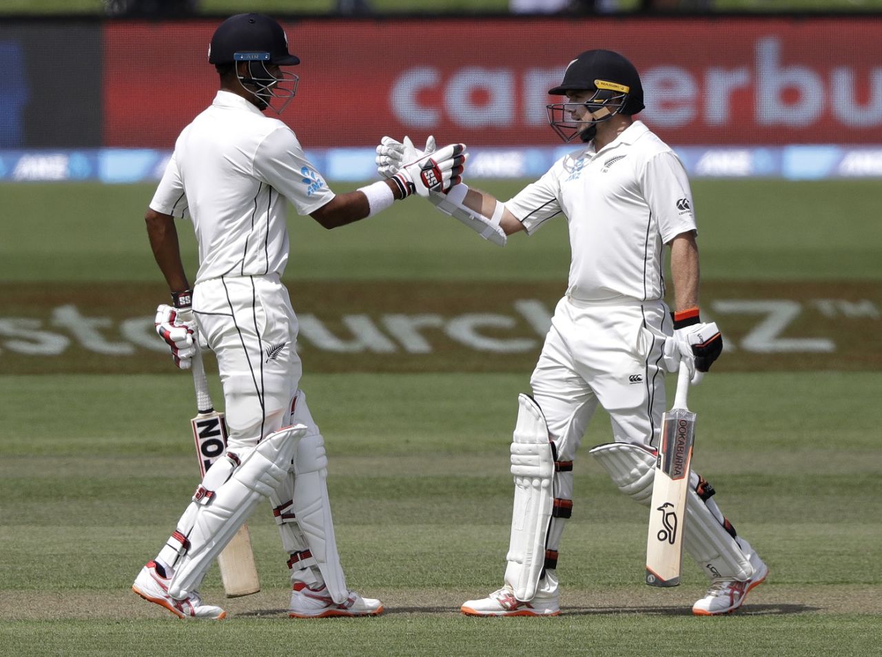 Jeet Raval and Tom Latham celebrate their 100-run partnership, New Zealand v Sri Lanka, 2nd Test, Christchurch, 2nd day, December 27, 2018