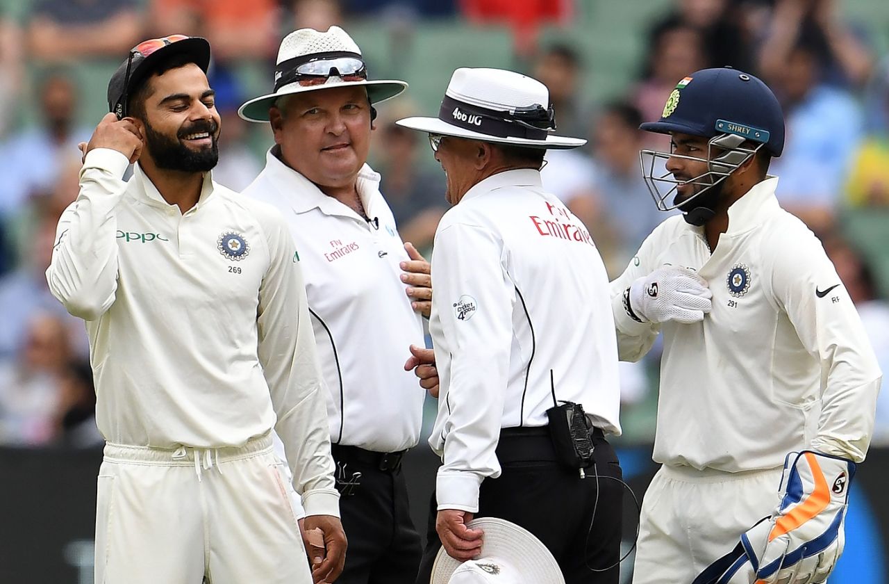 Virat Kohli, Rishabh Pant, Marais Erasmus and Ian Gould share a lighter moment, Australia v India, 3rd Test, Melbourne, 4th day, December 29, 2018