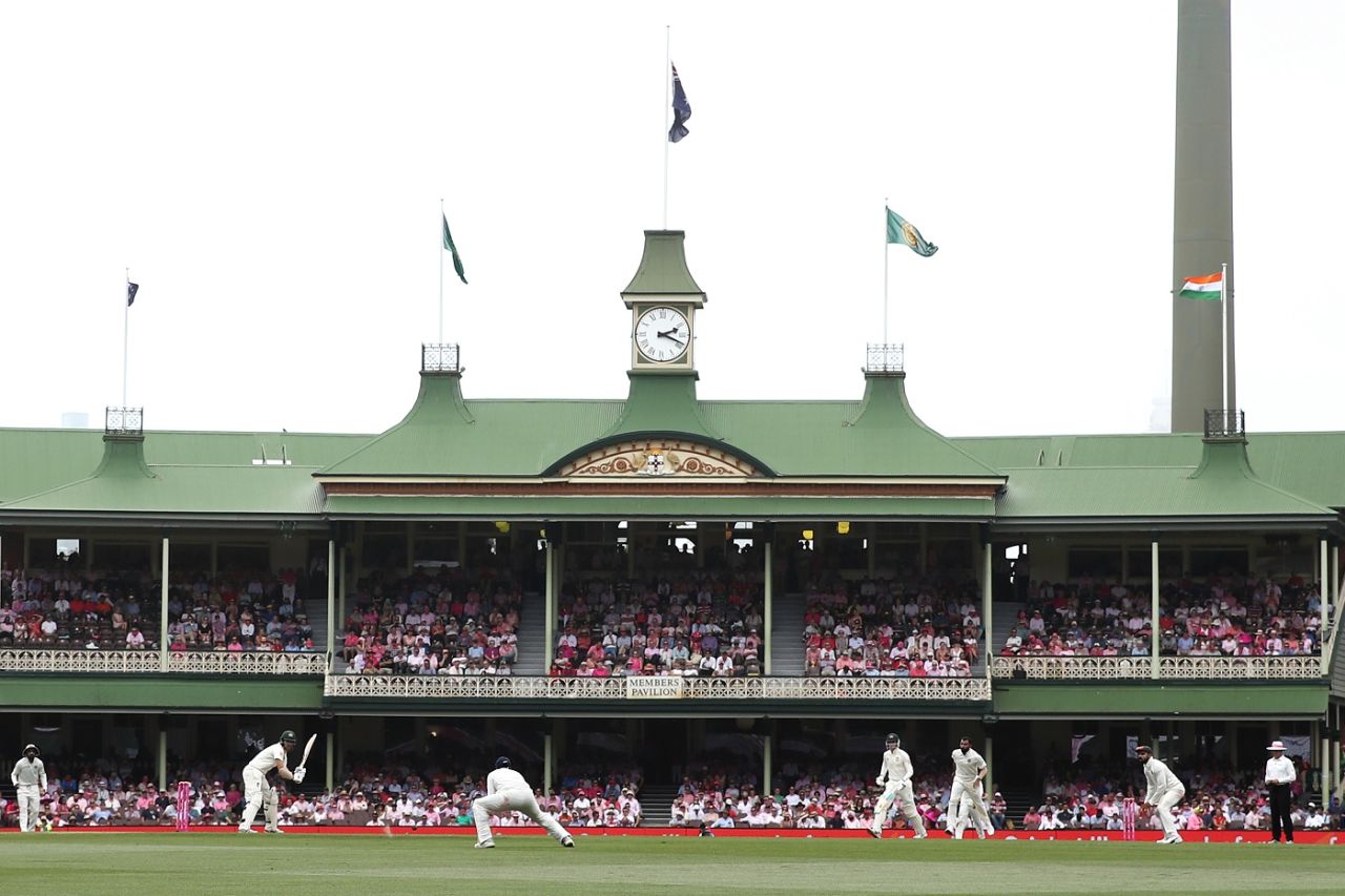 The SCG's members stand in the background as Travis Head plays a shot, Australia v India, 4th Test, Sydney, 3rd day, January 5, 2019