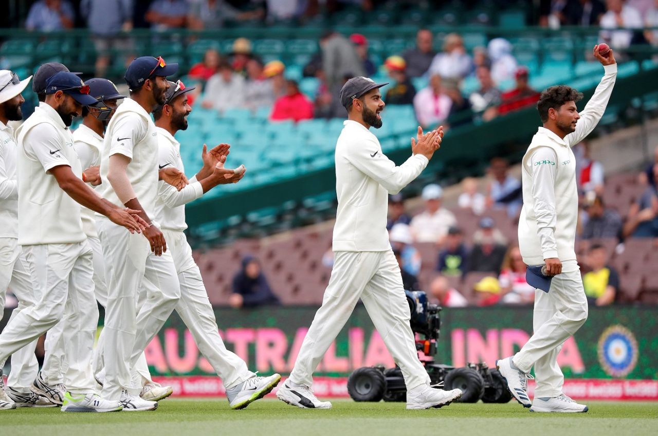 Kuldeep Yadav is cheered by his team-mates after his five-for, Australia v India, 4th Test, Sydney, 4th day, January 6, 2018