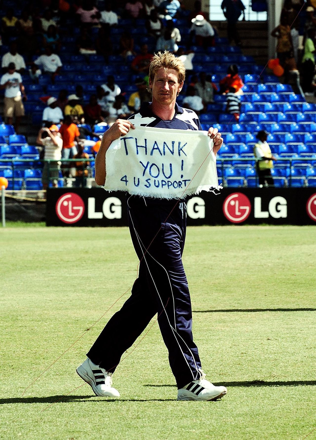 John Blain holds up a sign for Scotland supporters at the end of the team's defeat to Netherlands in the 2007 World Cup, Netherlands v Scotland, Group A, St Kitts, March 22, 2007