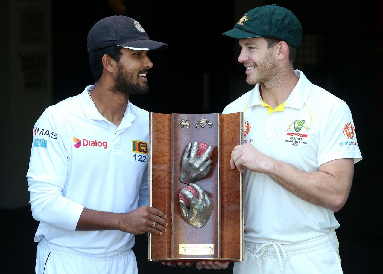 Dinesh Chandimal and Tim Paine pose with the Warne-Muralitharan Trophy, Brisbane, January 23, 2019