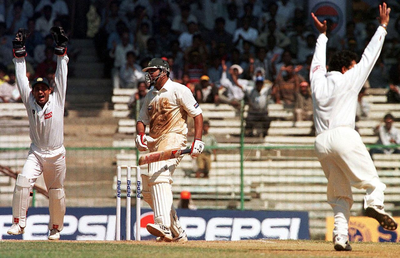 Sachin Tendulkar and Nayan Mongia celebrate the dismissal of Inzamam ul-Haq,  India v Pakistan, first Test, day three, Chennai, January 29, 1999