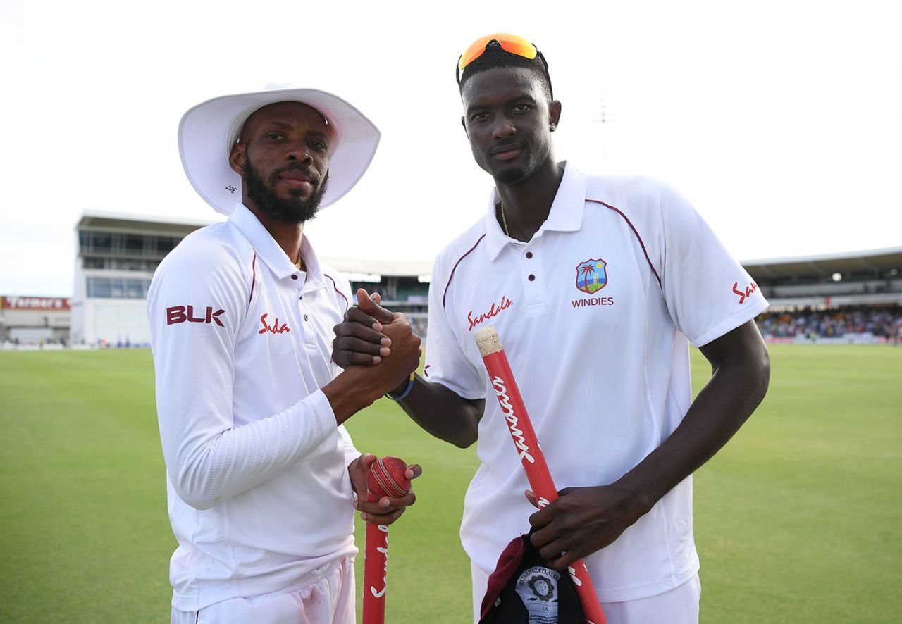 Roston Chase and Jason Holder celebrate West Indies' victory, West Indies v England, 1st Test, Barbados, 4th day, January 26, 2019