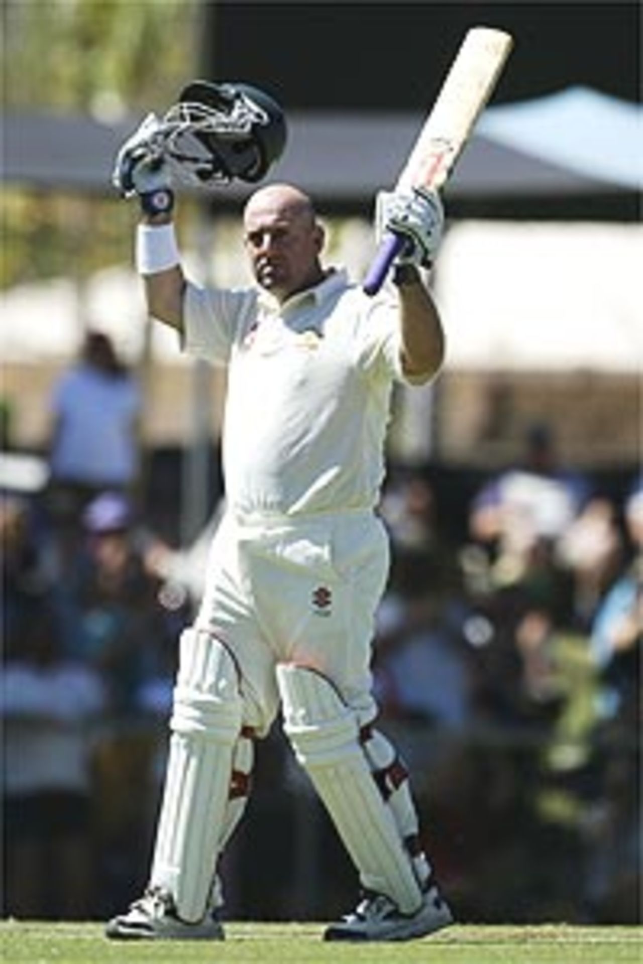 DARWIN - JULY 19: Darren Lehmann of Australia celebrates his century on July 19, 2003 during day two of the First Test between Australia and Bangladesh played at Marrara Oval, Darwin, Australia.