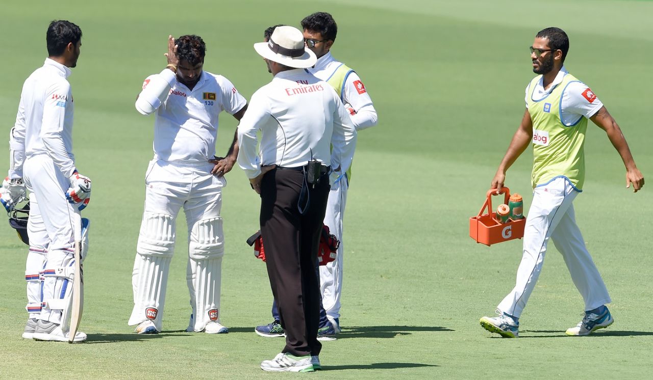 Kusal Perera receives medical attention after being hit on the helmet, Australia v Sri Lanka, 2nd Test, Canberra, February 3, 2019