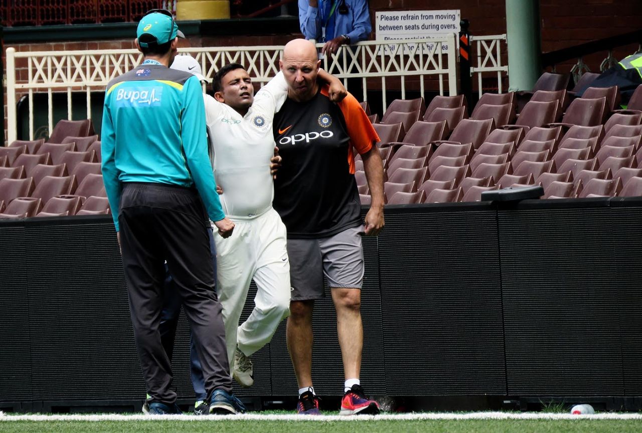 Prithvi Shaw is helped out of the field after injuring his ankle, Sydney, November 30, 2018