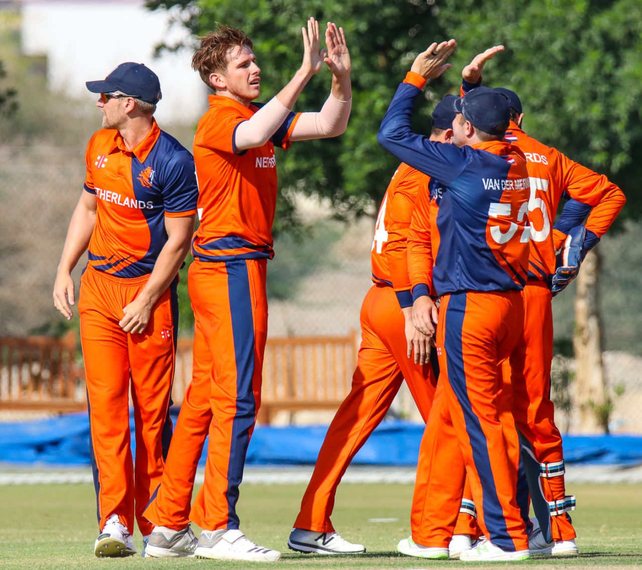 Fred Klaassen gets a round of high fives after his first wicket of the day, Netherlands v Scotland, Oman Quadrangular T20I Series, Al Amerat, February 13, 2019
