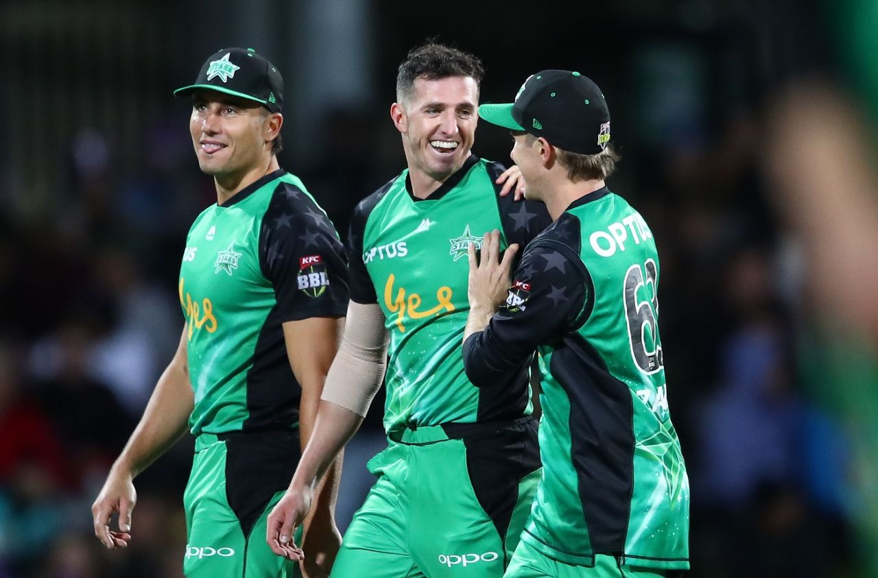 Daniel Worrall celebrates with his team-mates after his fourth wicket of the match, Hobart Hurricanes v Melbourne Stars, BBL 2018-19, Hobart, February 14, 2019
