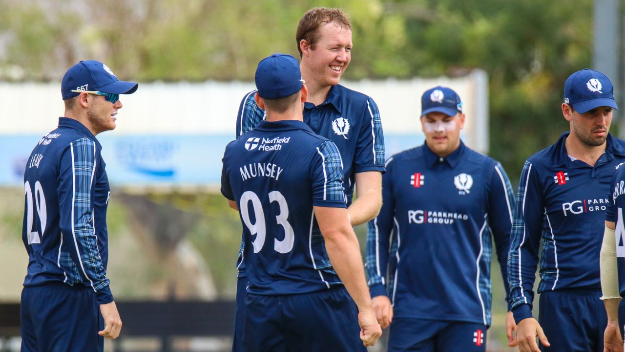 Adrian Neill celebrates with his teammates after his first wicket of the day, Oman v Scotland, Al Amerat, February 19, 2019