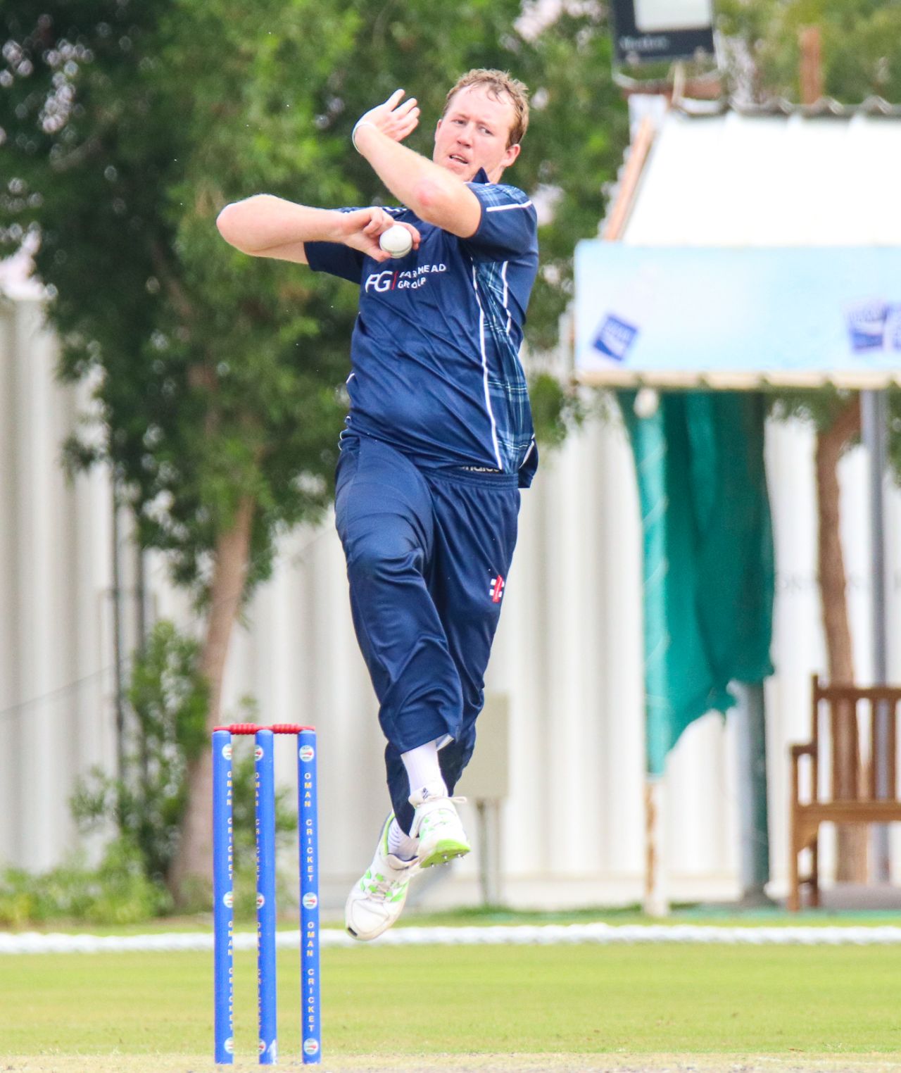 At 6'9", Adrian Neill is an imposing figure as he leaps into his delivery stride, Oman v Scotland, Al Amerat, February 19, 2019