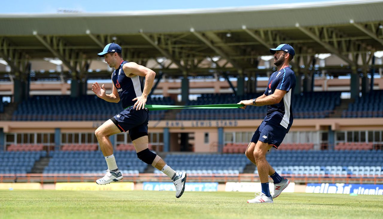 Chris Woakes warms up with Liam Plunkett during a nets session at the National Cricket Stadium, Grenada, February 24, 2019