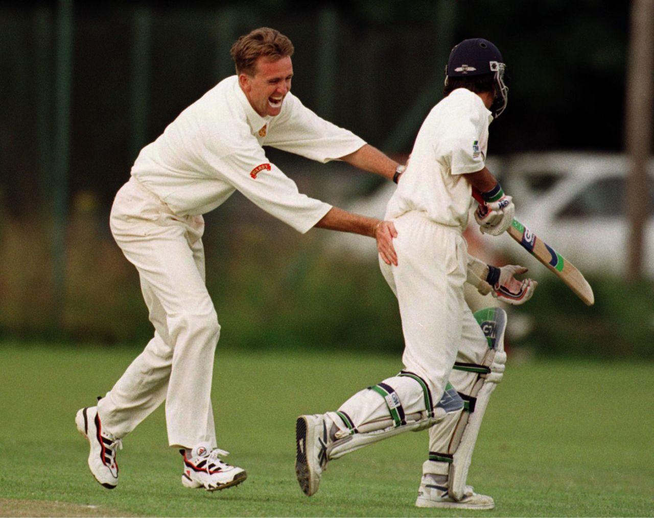 Dominic Cork playfully pats Michael Vaughan on his backside, Derbyshire Second XI v Yorkshire Second XI, July 21, 1997