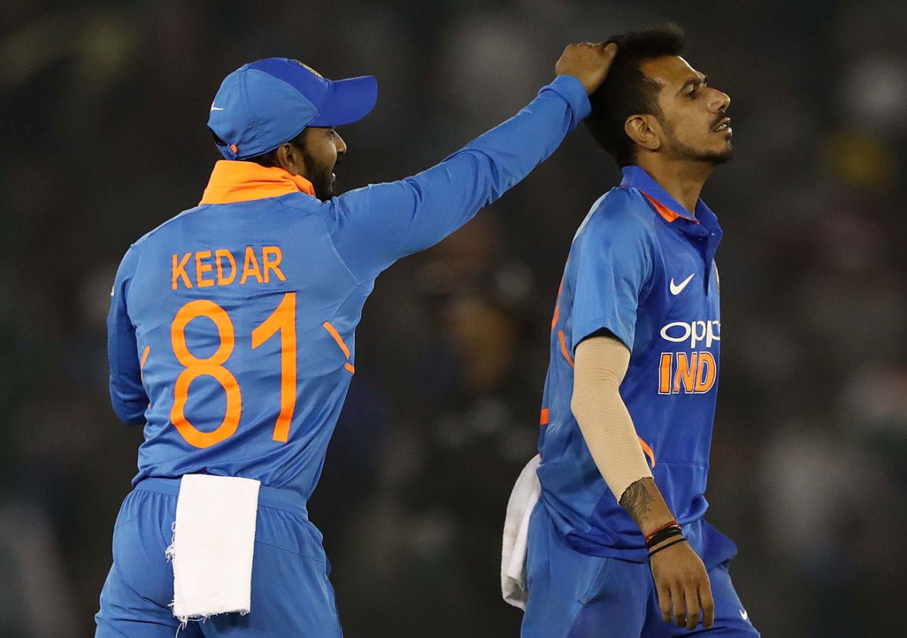 Kedar Jadhav has some fun with Yuzvendra Chahal's hair after the latter picked a wicket, India v Australia, 4th ODI, Mohali, March 10, 2019