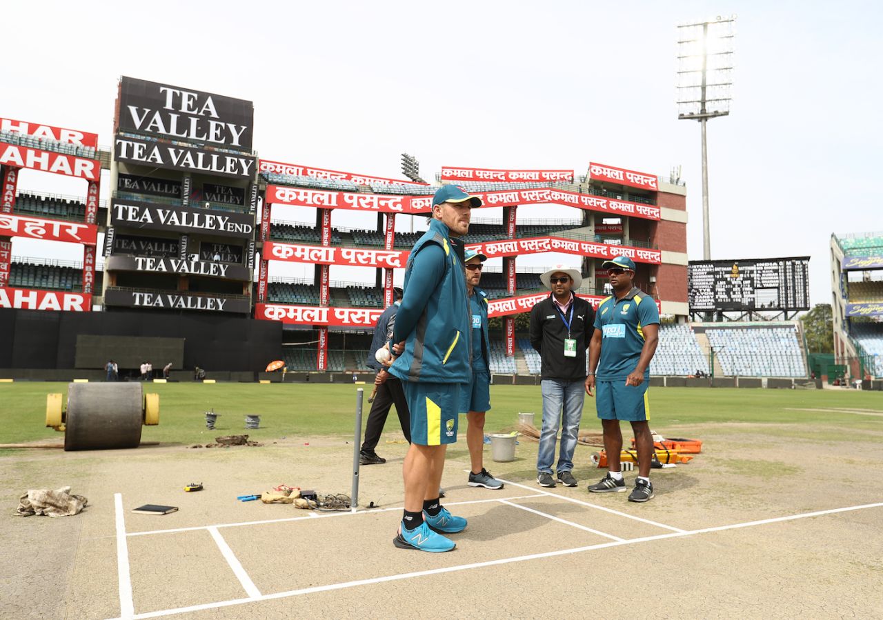Aaron Finch has a look at the pitch on the eve of the match, Delhi, March 12, 2019