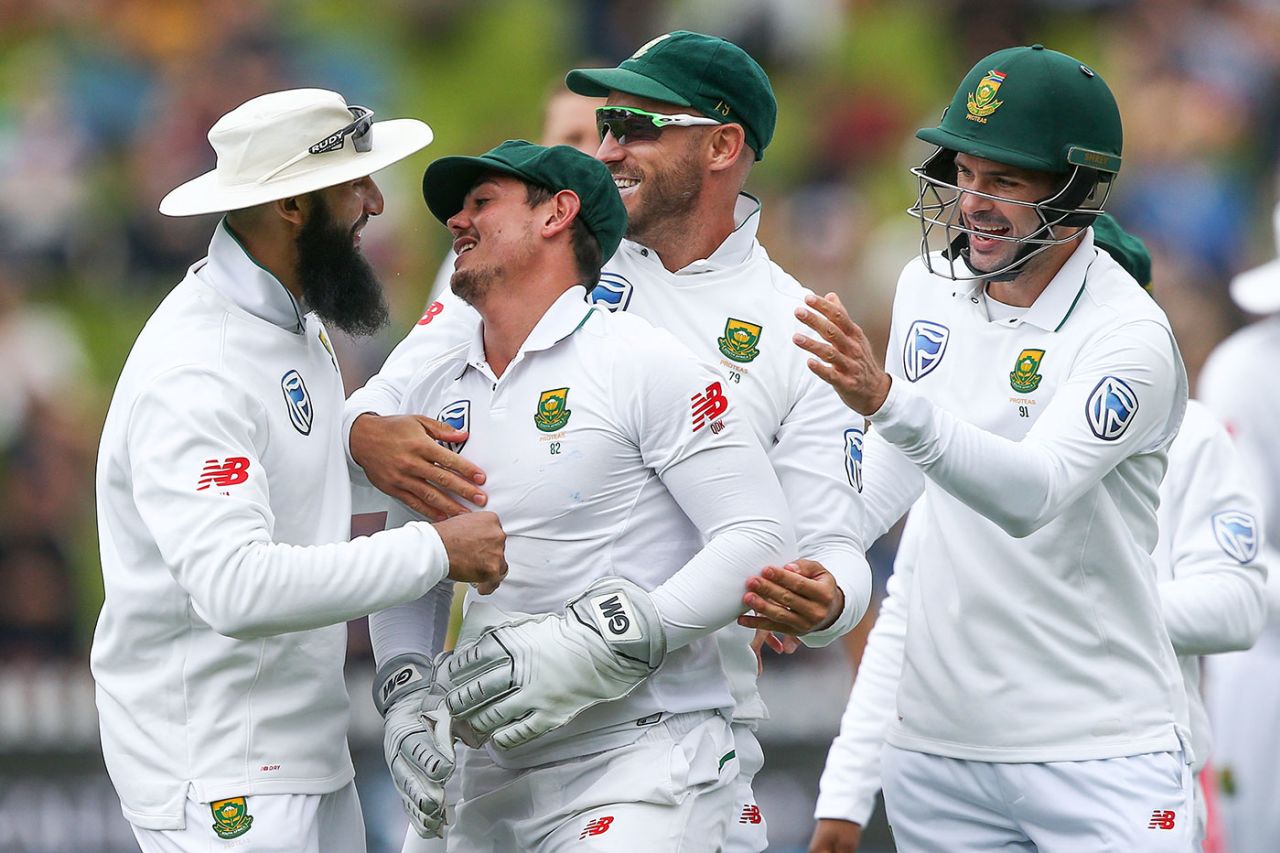 Quinton de Kock is mobbed after his catch to remove Neil Broom, New Zealand v South Africa, 2nd Test, Wellington, 3rd day, March 18, 2017