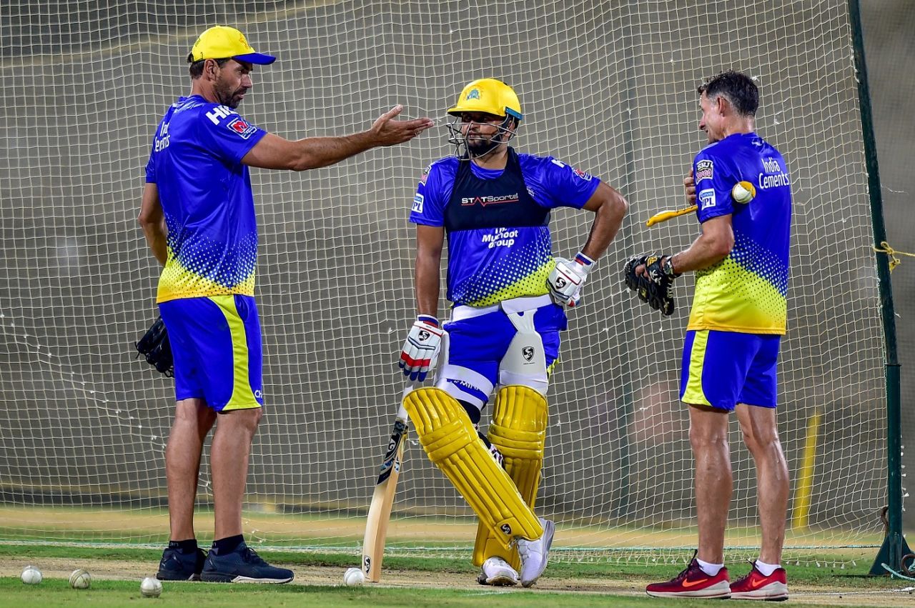 Suresh Raina gets some pointers from Stephen Fleming and Mike Hussey