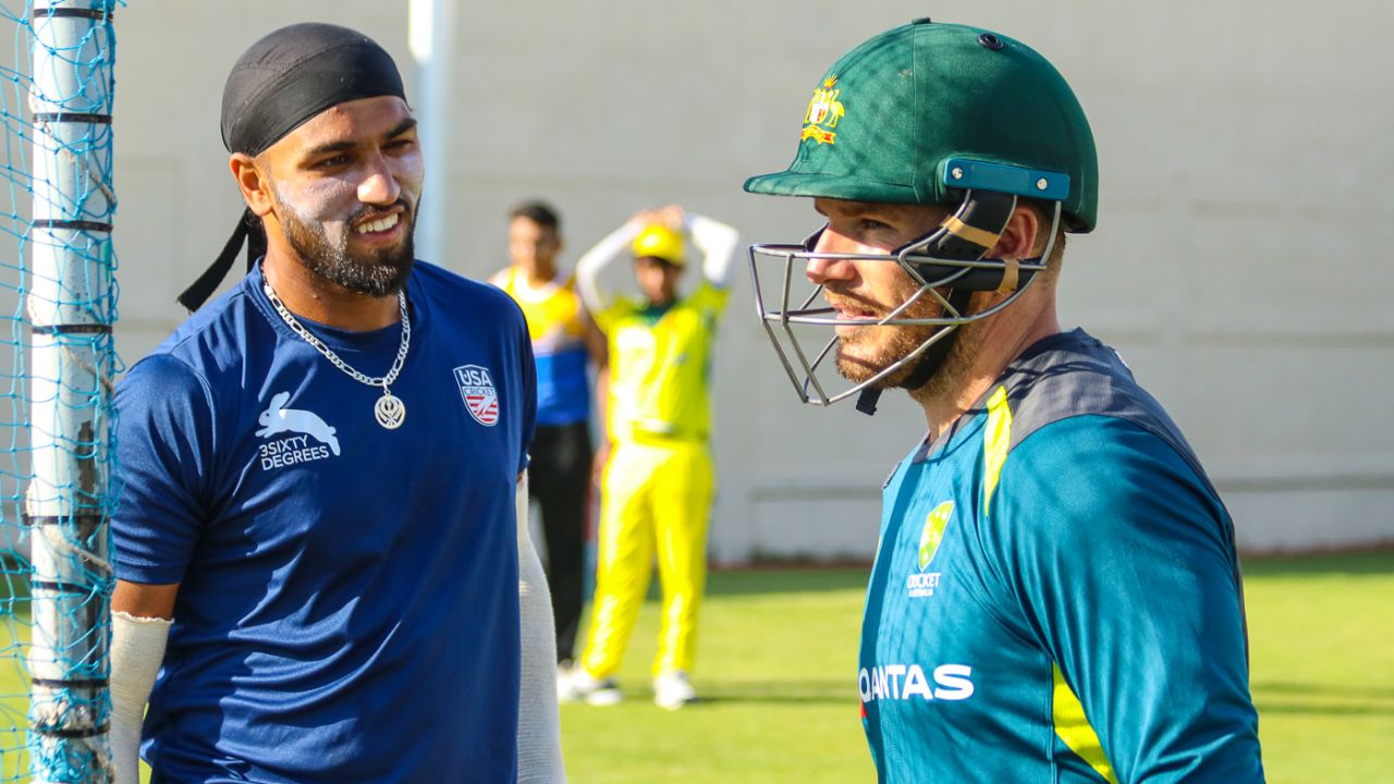 USA fast bowler Jessy Singh and Australia captain Aaron Finch share a light moment in the nets, Sharjah, March 20, 2019