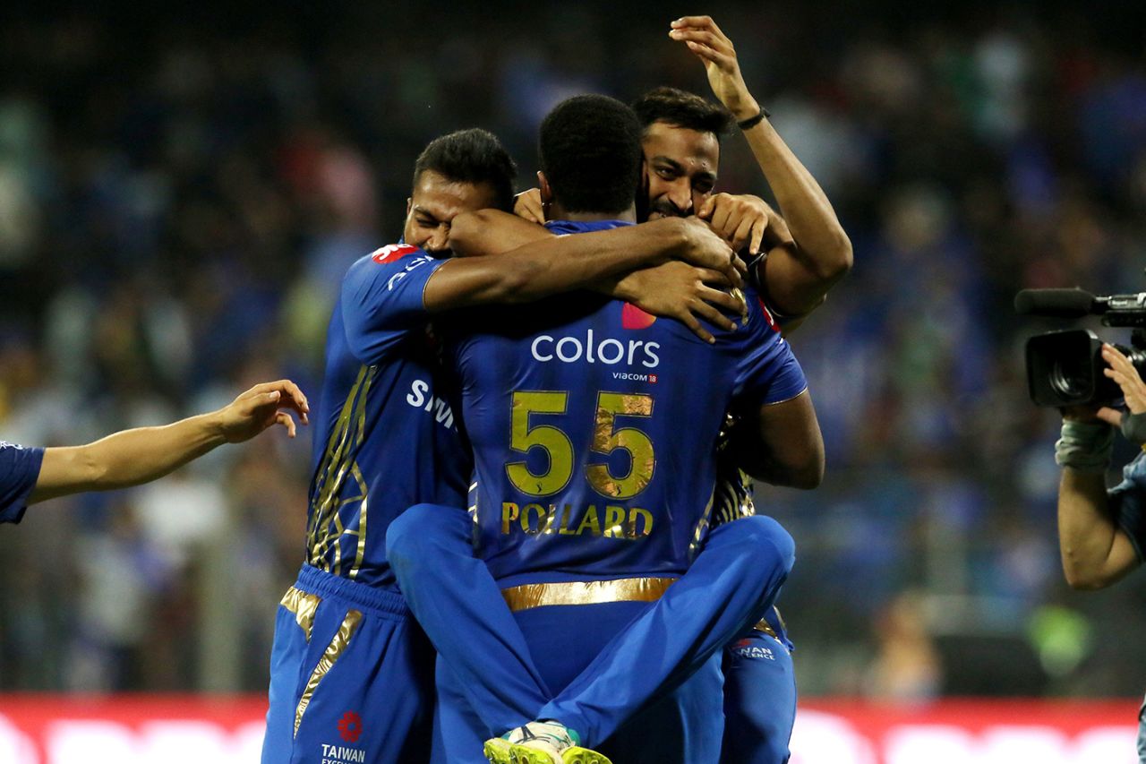 The Pandyas pile onto Kieron Pollard after Mumbai seal a last-ball win, Mumbai Indians v Kings XI Punjab, IPL 2019, Mumbai, April 10, 2019