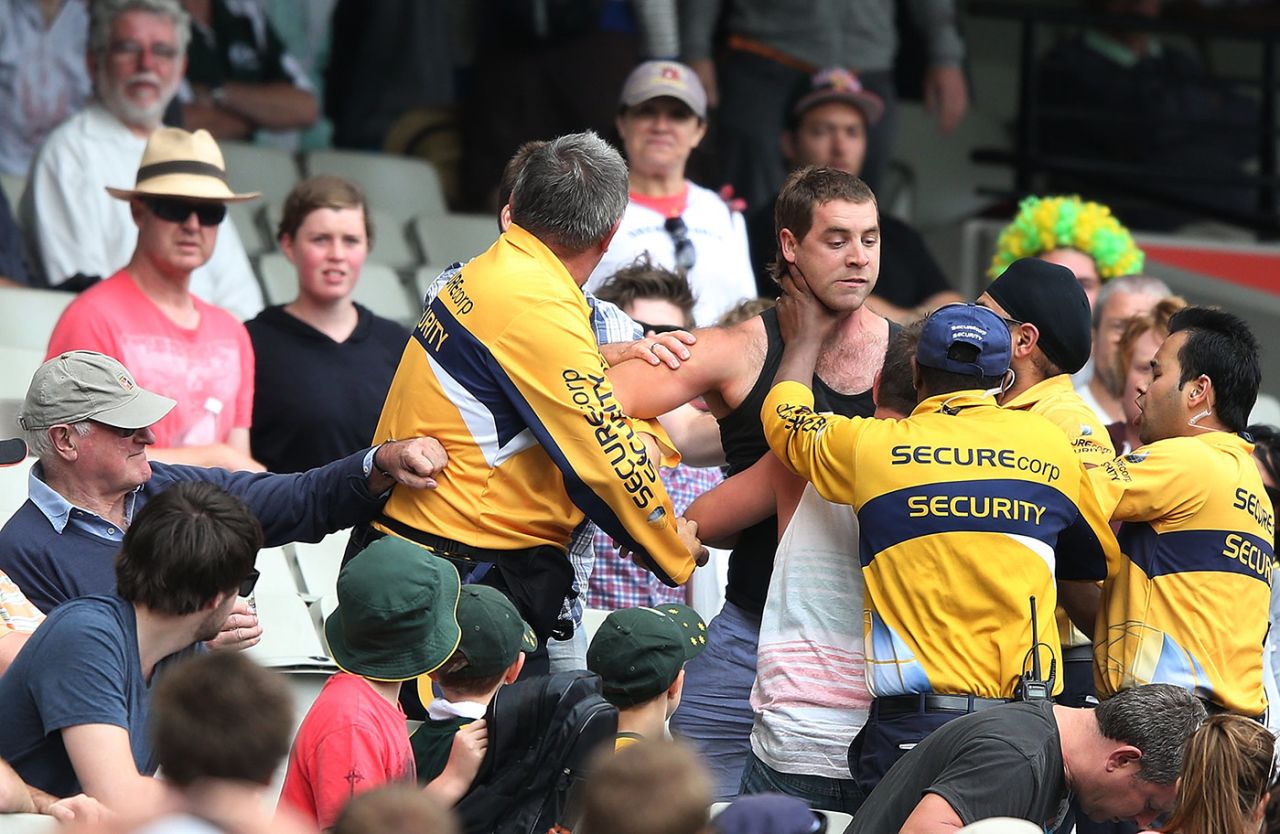 Security staff attempt to take a spectator away, Australia v Sri Lanka, 2nd Test, day two, Melbourne, December 27, 2012