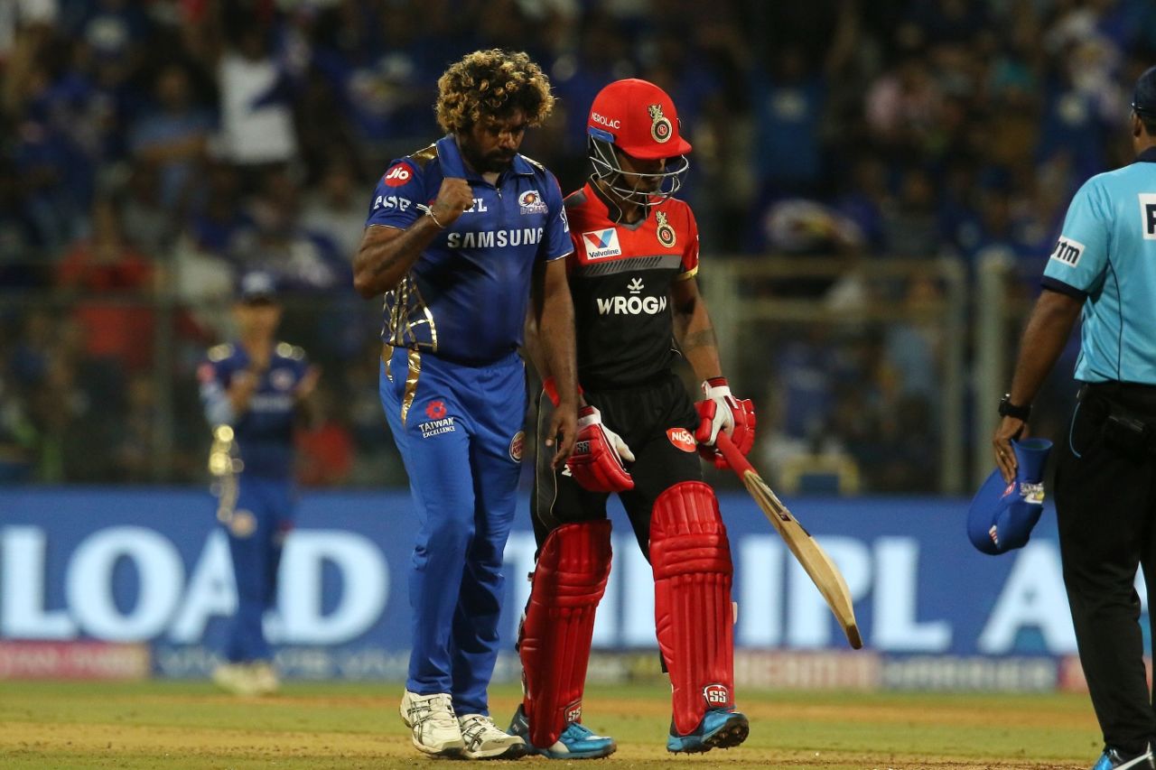 Lasith Malinga walks back to his mark after picking up a wicket, Mumbai Indians v Royal Challengers Bangalore, IPL 2019, Mumbai, April 15, 2019