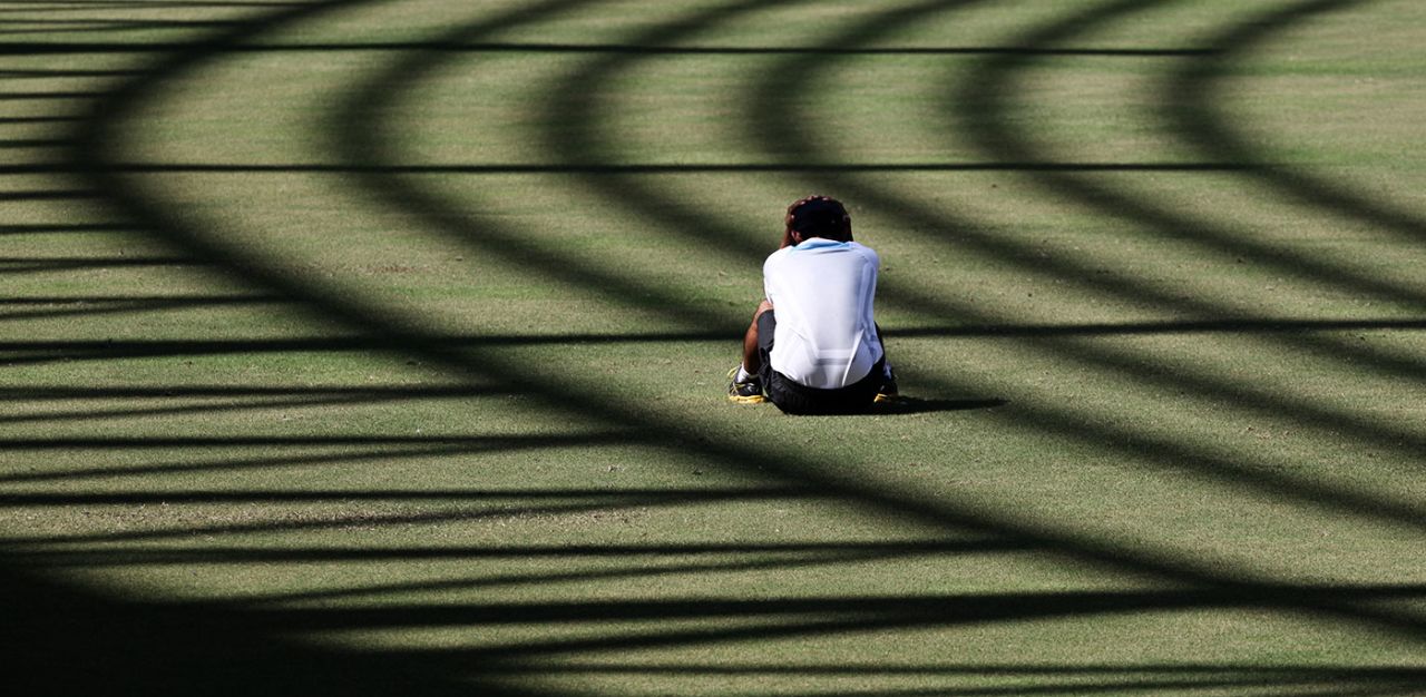 Gautam Gambhir sits on the field during a practice session, Mumbai, November 20, 2011