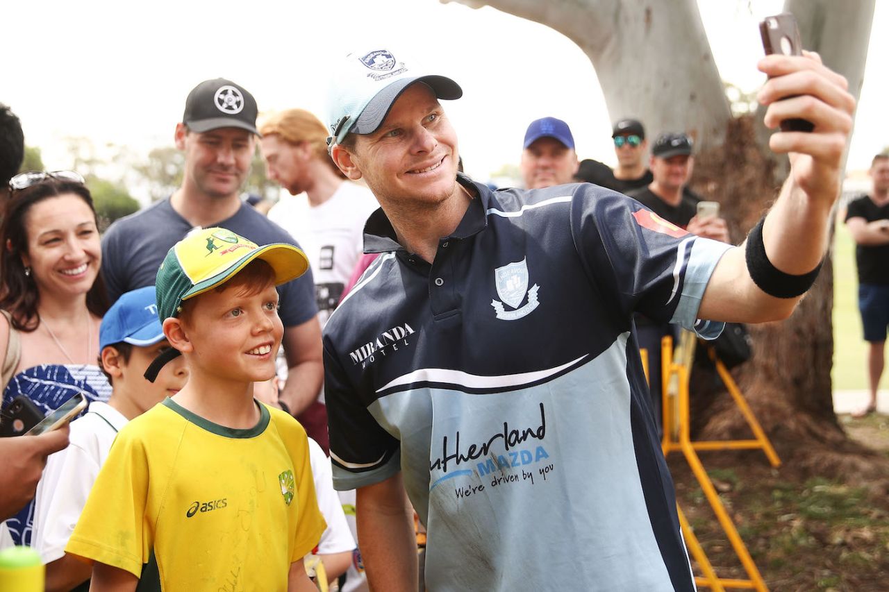 Steven Smith takes pictures with fans