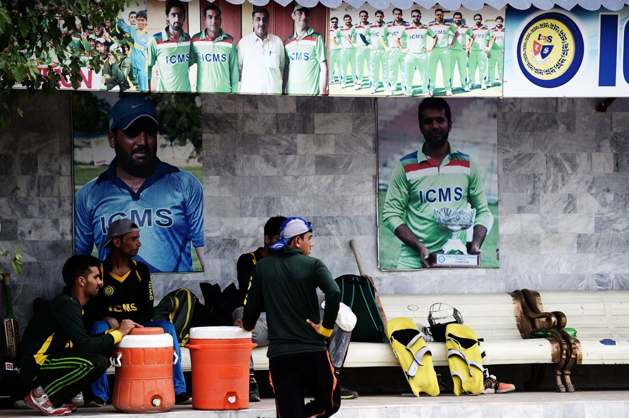A poster of Afghanistan cricketer Mohammad Shahzad(left) in the Gymkhana Cricket Academy in Peshawar, July 6, 2017