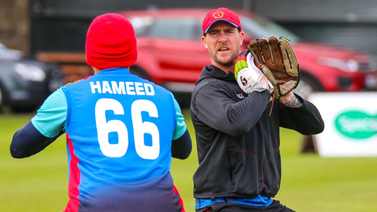 Fielding coach John Mooney demonstrates catching technique during Afghanistan training, Edinburgh, May 7, 2019