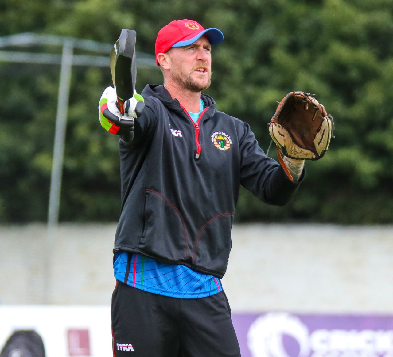 Fielding coach John Mooney directs the squad during an Afghanistan training session, Edinburgh, May 7, 2019