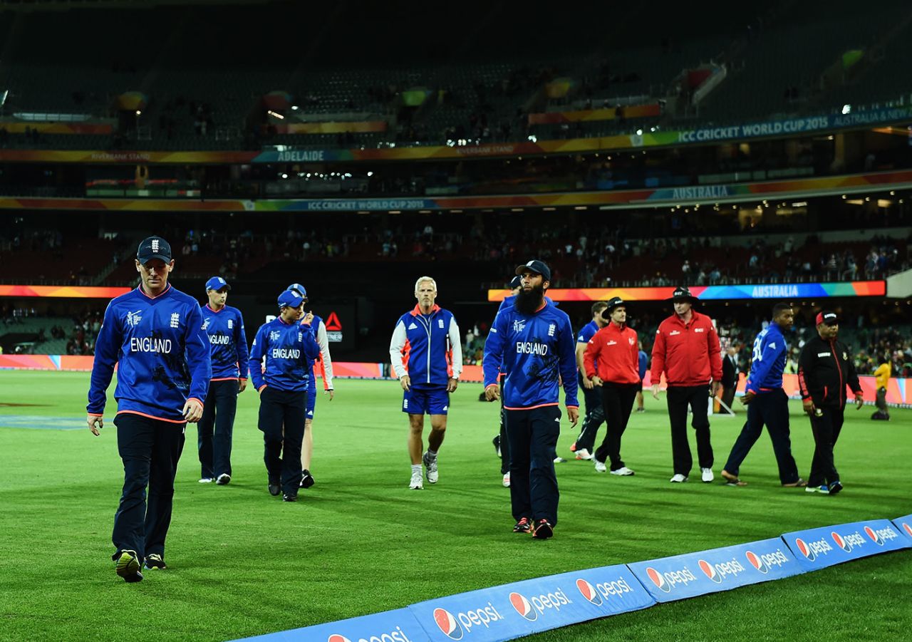 Eoin Morgan and the England players walk back after their defeat to Bangladesh, England v Bangladesh, World Cup 2015, Group A, Adelaide, March 9, 2015