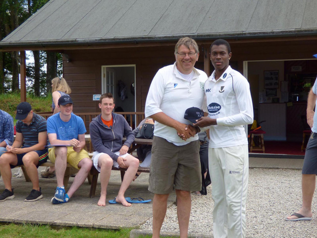 Jofra Archer receives his cap from Jon Filby, Lanhydrock, June 23, 2015