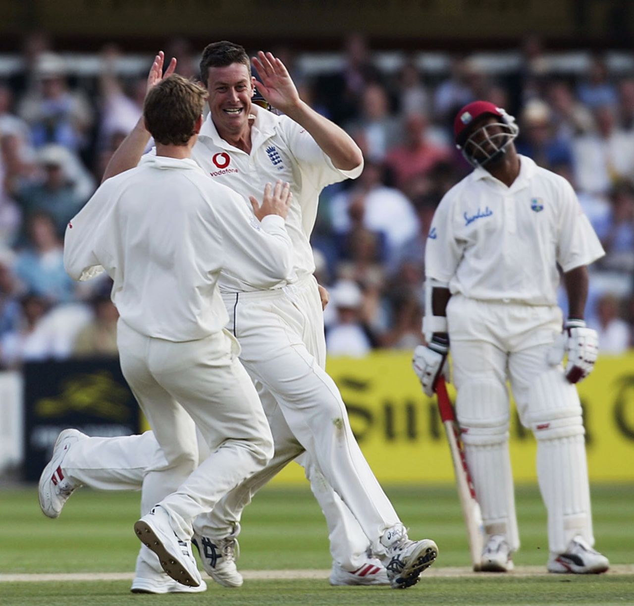 Ashley Giles celebrates as Brian Lara looks on disconsolately, England v West Indies, 1st Test, Lord's, 5th day, July 26, 2004