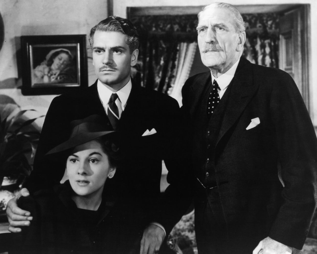 C Aubrey Smith (right) with Joan Fontaine and Laurence Olivier in a scene from the film 'Rebecca', 1940