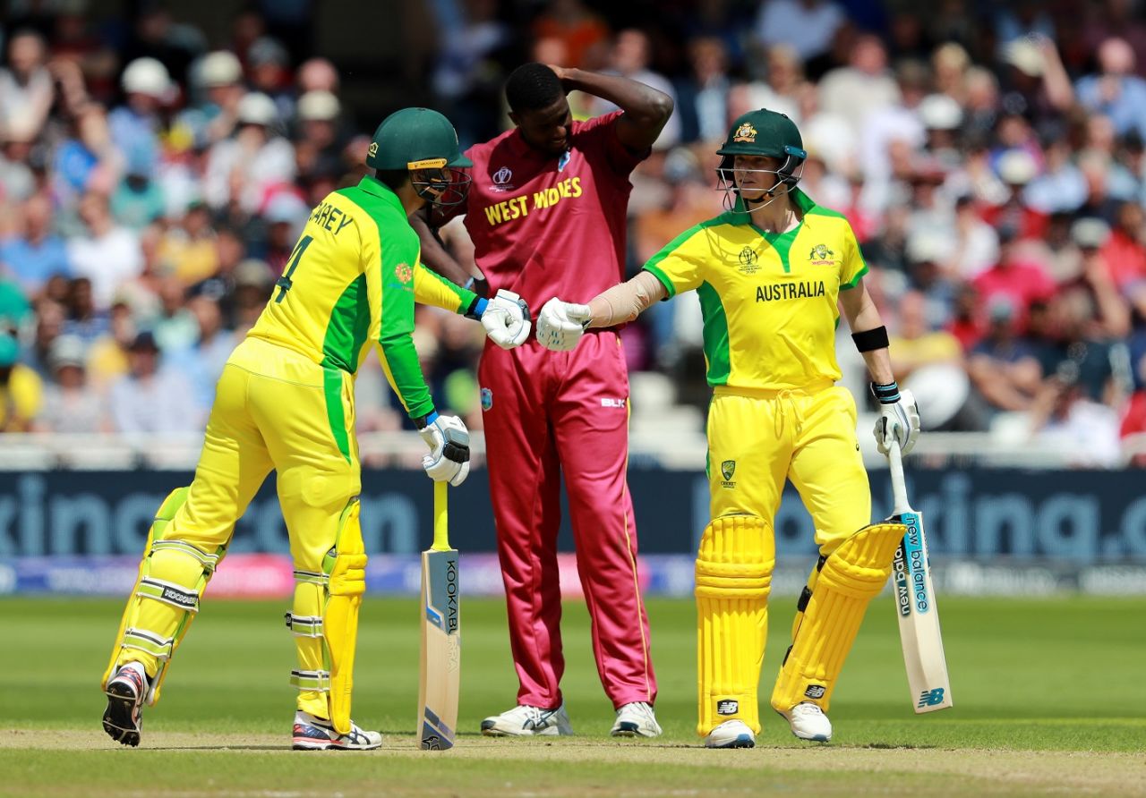 Jason Holder looks disappointed as Steve Smith and Alex Carey celebrate a boundary, Australia v West Indies, World Cup 2019, Trent Bridge, June 6, 2019