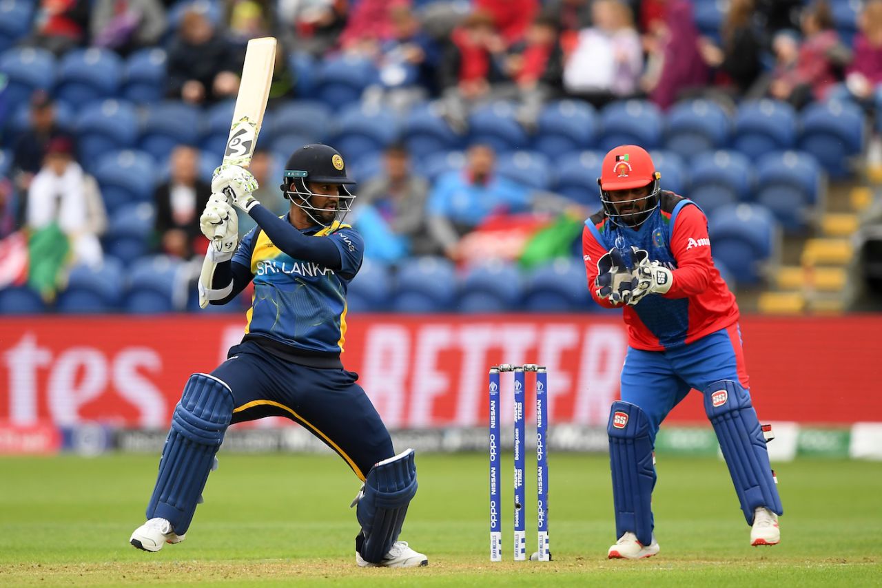 Dimuth Karunaratne sends one away watched by Mohammad Shahzad, seventh match,  World Cup 2019, Afghanistan v Sri Lanka, Cardiff, Wales, June 04, 2019
