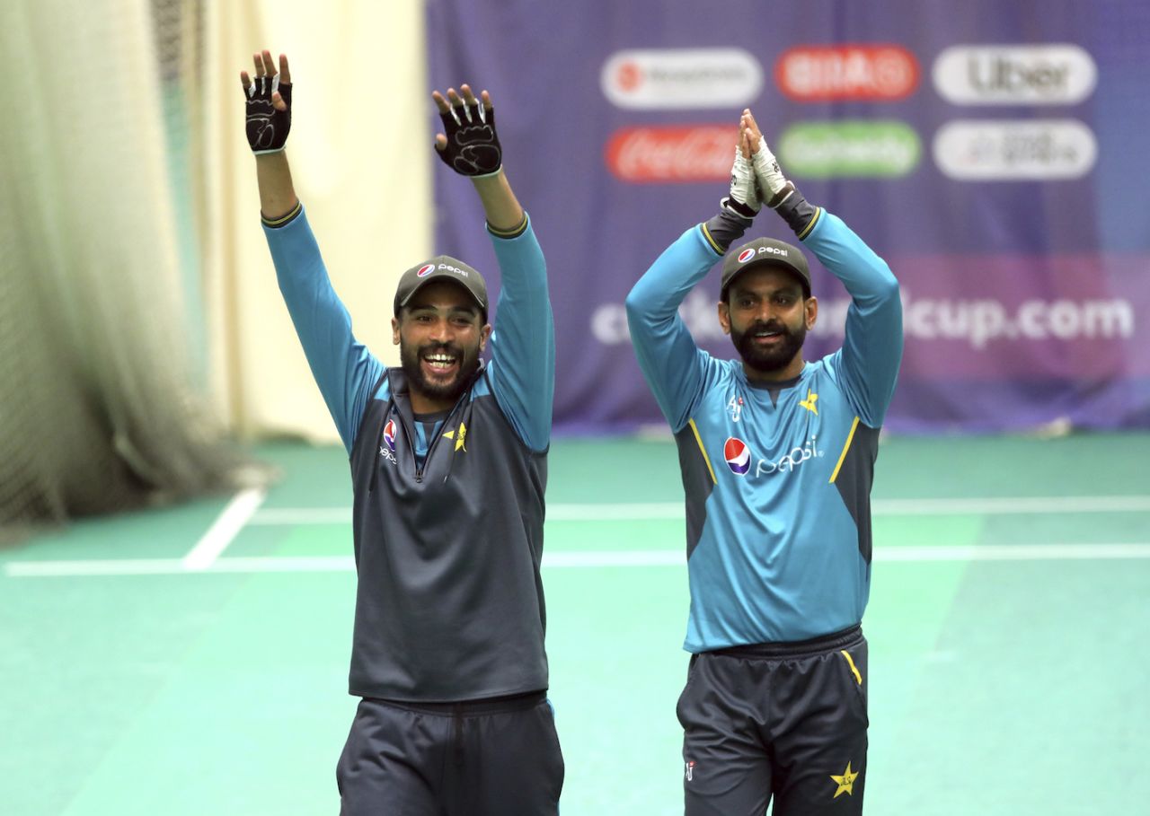 Mohammad Amir and Mohammad Hafeez cheer their team-mates during a nets session, World Cup 2019, Old Trafford, June 15, 2019