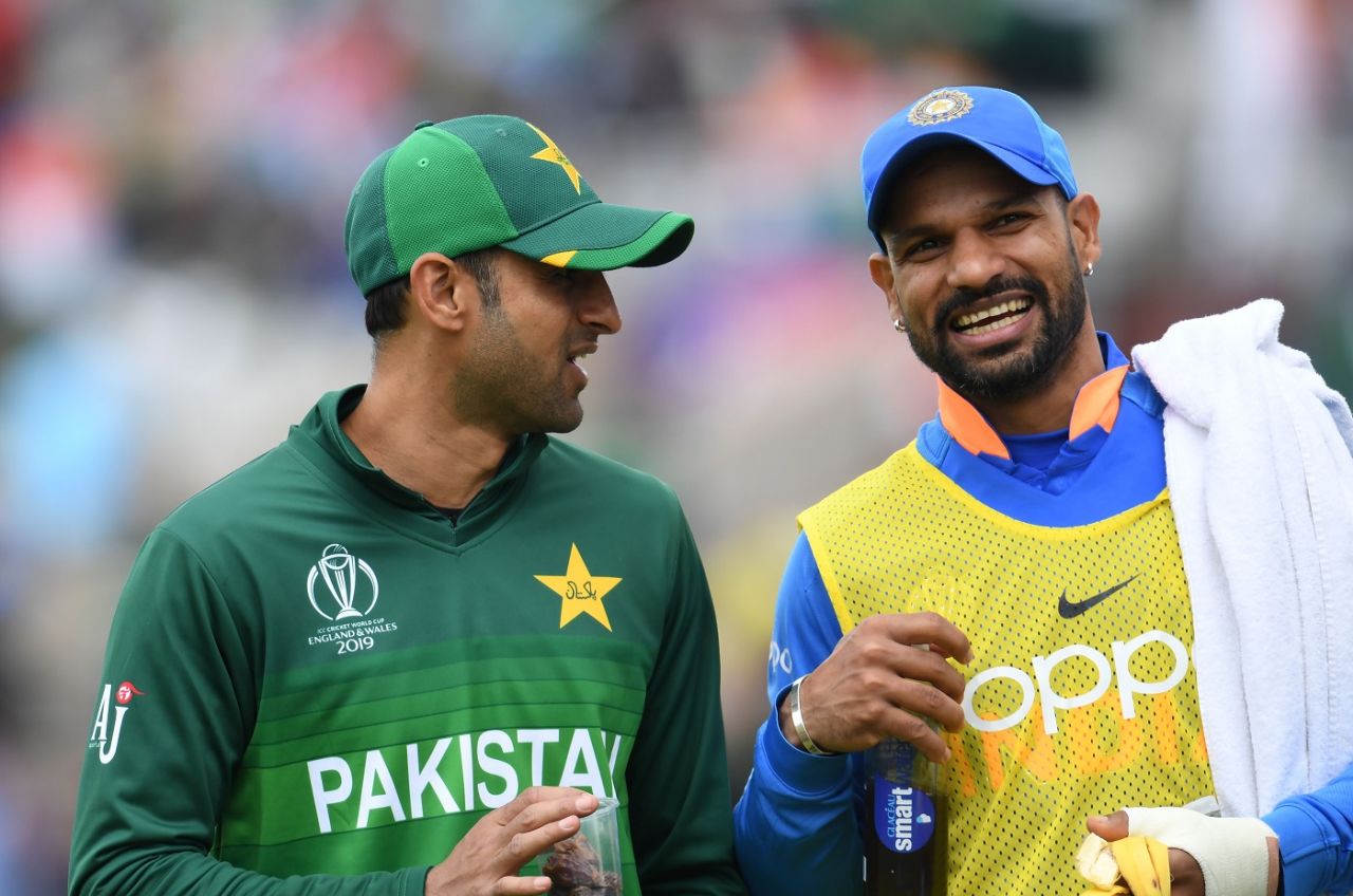 Shoaib Malik and Shikhar Dhawan share a light moment during a drinks break, India v Pakistan, World Cup 2019, Manchester, June 16, 2019