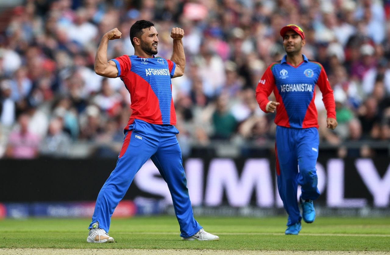 Gulbadin Naib flexes his biceps in celebration after catching Jonny Bairstow off his own bowling, England v Afghanistan, World Cup 2019, Manchester, June 18, 2019