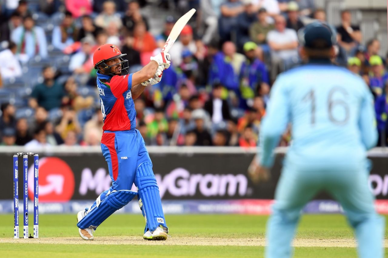 Gulbadin Naib goes on the attack as Eoin Morgan looks on, England v Afghanistan, World Cup 2019, Manchester, June 18, 2019